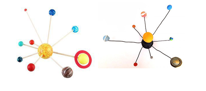 макет солнечной системой вместе с ребенком